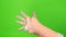 Hand making physical therapy to broken wrist from accident isolated on green screen background