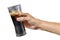 Hand of a man holding a cola glass with ices