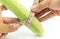 Hand man measuring size of long cucumber