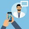 Hand of a man with a mobile phone. online doctor`s consultation concept. man doctor with stethoscope on the screen, concept of onl