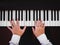Hand man playing piano. Classical music instrument. Top view