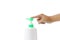 Hand of man is pressing on the green pump of white plastic bottle