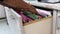 Hand of Man Search files document in a file cabinet in work office, concept business office life.