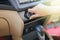 Hand of man turning on car air conditioning system,Button on dashboard in car