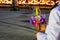 Hand man, woman wearing white dress, servant holding flowers and candles  Join the ceremony at the Thai temple at night