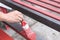 Hand of a man worker holding a paintbrush painted steel for industrial.