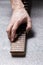 Hand of a master on the fretboard of a guitar.