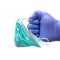 Hand with medical gloves hold a medical mask Fighting the coronavirus pandemic. White background with copy space