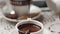 Hand mixing chocolate in a hot milk, preparing hot chocolate or cacao, bautiful soft focus shot