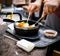 Hand Mixing Korean bibimbab hot pot.