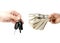 Hand with money and car keys