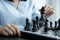 Hand move chess with strategy and tactic to win enemy, play battle on board game, business opportunity  competition strategic