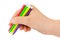 Hand with multicolored pens