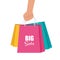 Hand with multicolored shopping bags. Big sale concept vector Illustration