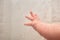 Hand Of Newborn Caucasian Baby Under Shower Close Up With Lots Of Splashes