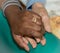 Hand of nurse holding a senior woman. Concept of helping hands, care for the elderly