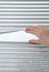 Hand opening venetian blinds for peeking