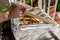 Hand opens homemade box for melting bees wax