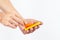 Hand with orange stickers on white background