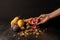 hand with organic autumnal fruits