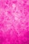 Hand painted abstract ice watercolor texture in monochrome bright pink as background for copy space