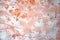 Hand painted abstract splatter watercolor texture in monochrome orange as background for copy space
