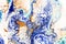 Hand painted background with mixed liquid blue, white, yellow paints. Abstract fluid acrylic painting. Applicable for