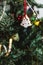 Hand painted Christmas gingerbread white tree on Christmas tree. Close-up