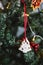 Hand painted Christmas gingerbread white tree on Christmas tree. Close-up