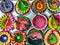 Hand painted, colorful Diwali Diyas arranged for close up photograph