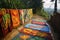 hand-painted indian sari fabric drying outdoors