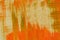 Hand painted multi-layered orange background with scratches