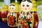 Hand-Painted Nesting Dolls in Reds and Yellows