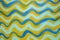Hand painted ripples of blues and turquoise and yellow background