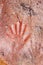 Hand painting of six fingers in the cave of the hands