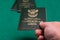 Hand passing South African passport