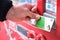 Hand paying with suica card in a japanese drink vending machine, jidouhanbaiki.