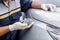 Hand of people using stainless steel wool to polishing the surface of car body