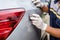 Hand of people using stainless steel wool to polishing the surface of car body