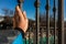 Hand of a person catching a fence