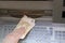 Hand of person that withdraws euro banknotes from an ATM of a Eu