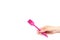 Hand with pink culinary brush, kitchen utensil