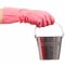 Hand in a pink glove holding silver pail