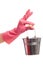 Hand in a pink glove holding silver pail