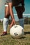 Hand, placing and soccer ball on field for free kick, penalty or goal in game, training or match. Woman, football and