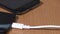 Hand plug white and black micro usb cable to smart phones