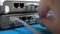 Hand plugs ethernet cable into router