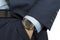 Hand in pocket with wrist watch in a business suit close up