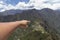 hand pointing to machu picchu, Huaynapicchu Mountain, Machu Picchu, Peru - Ruins of Inca Empire city