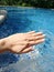 Hand by the pool